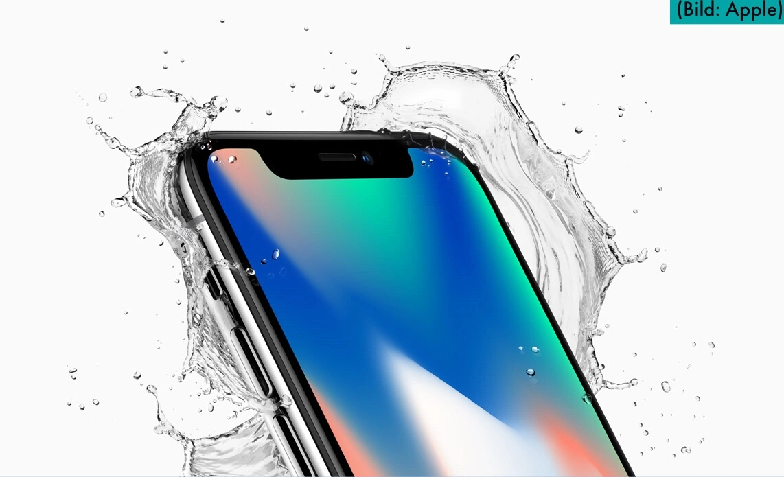 OLED display of an iPhone X with splashing water in the background