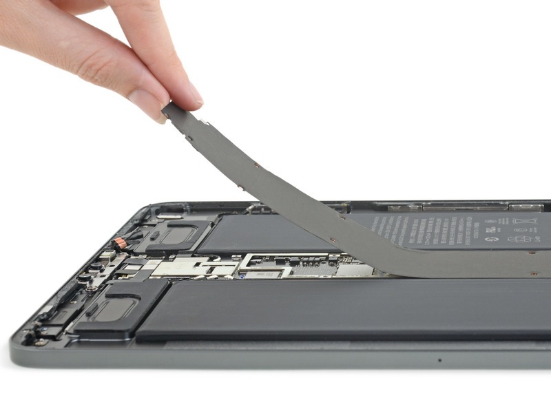 iFixit teardown of the 2018 iPad Pro with tools for removing the battery and adhesive.