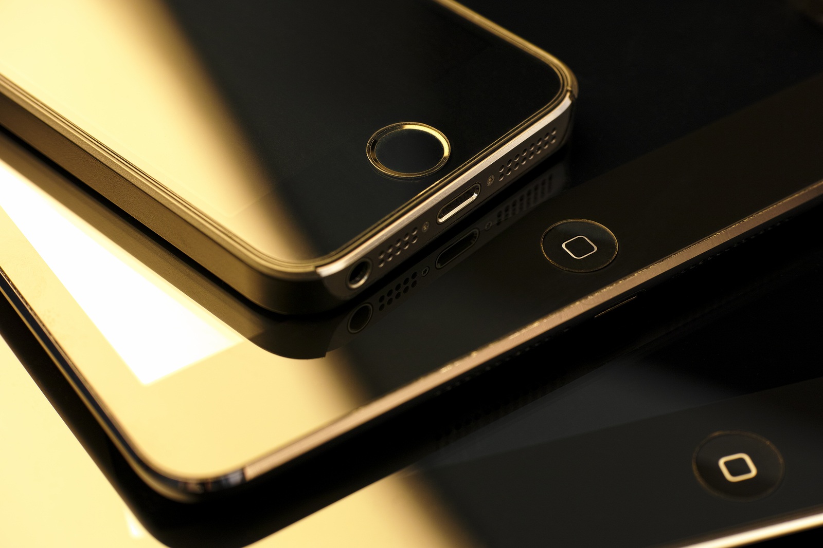 Tambov, Russian Federation - February 26, 2015 Close up of stack of Apple devices - iPhone 5s, iPad mini and iPad 2. Studio shot.