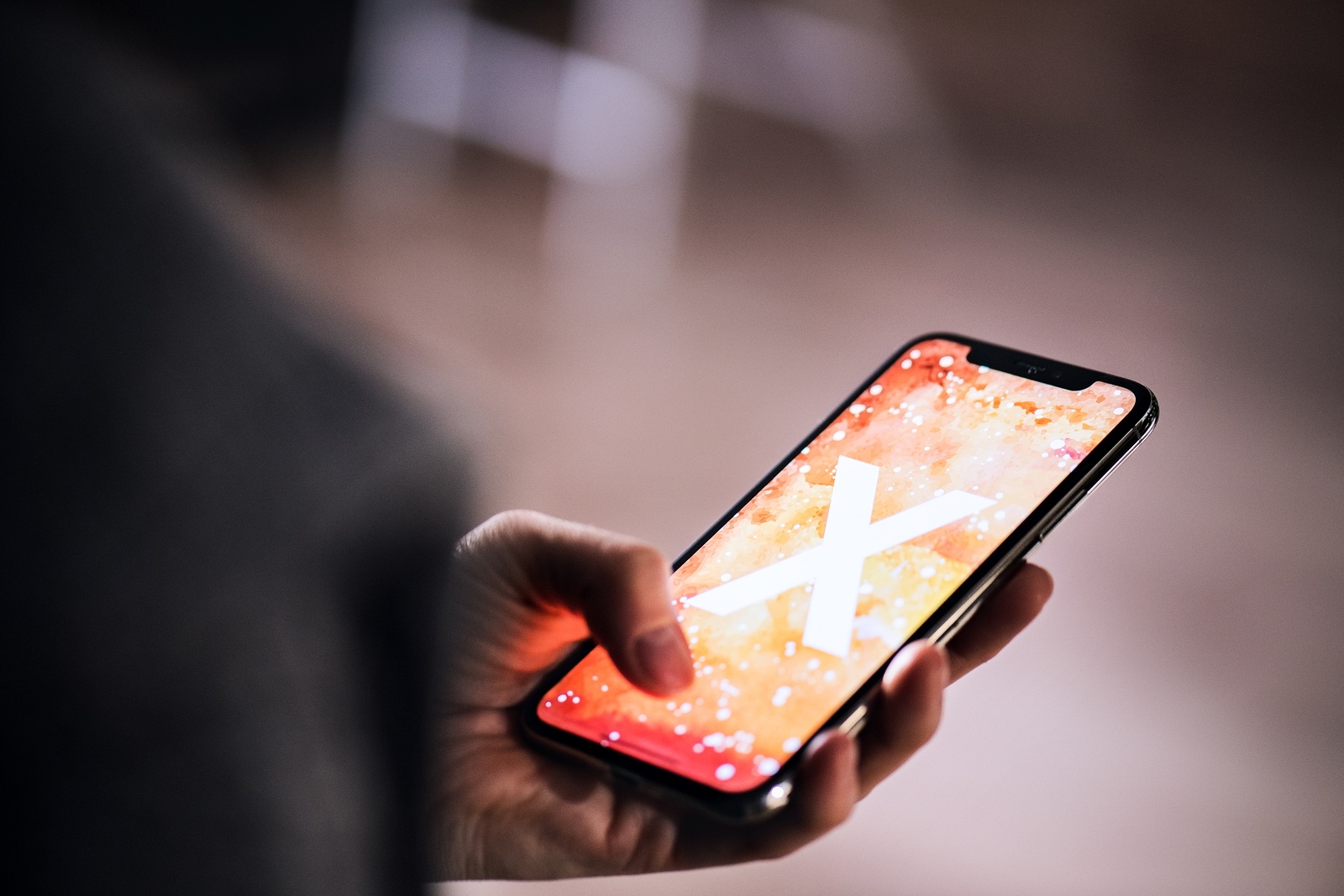 NOVA BANA, SLOVAKIA - NOV 28, 2017: A hand holding a new Apple iPhone X smartphone.