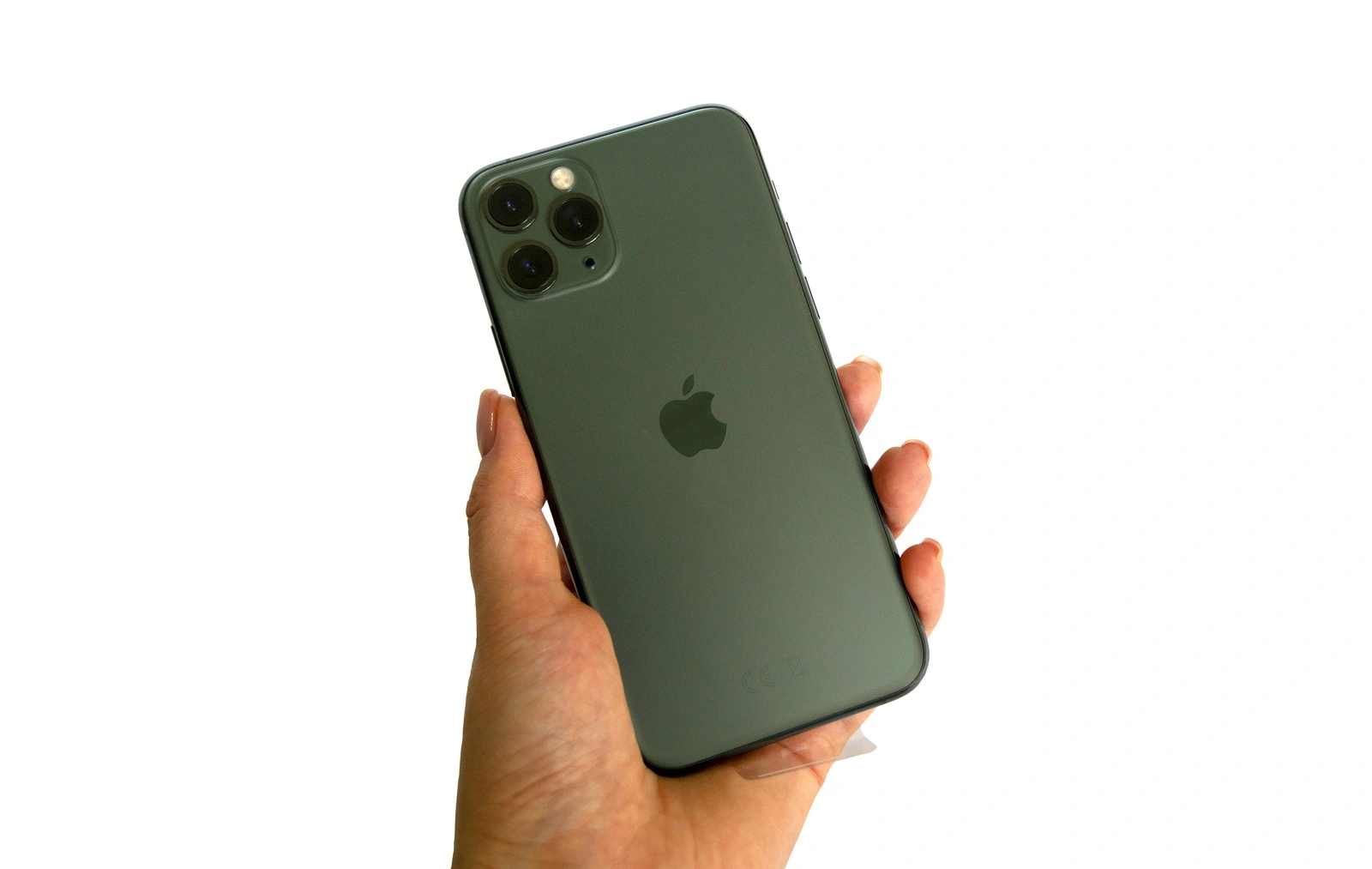 Dubai / UAE - September 21, 2019: New Midnight Green Apple iPhone 11 Pro in hand isolated on white background.