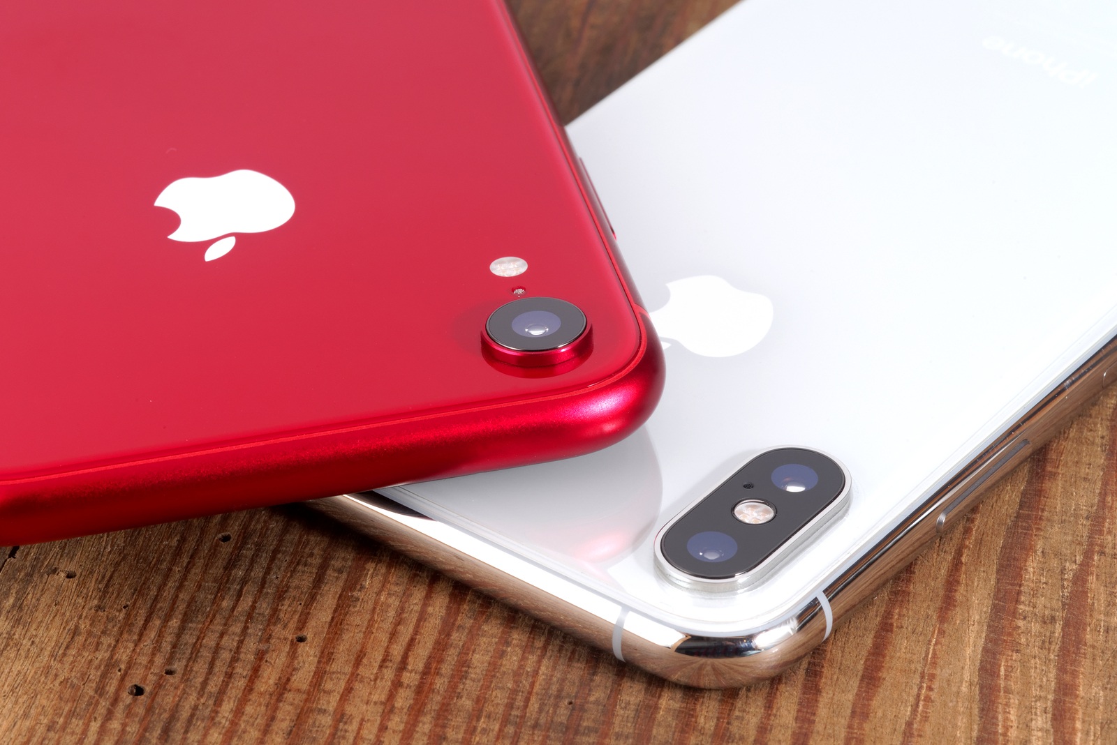 Koszalin, Poland - November 29, 2018: Silver iPhone Xs and red iPhone XR. The iPhone Xs and iPhone XR is smart phones with multi touch screen produced by Apple Computer, Inc.