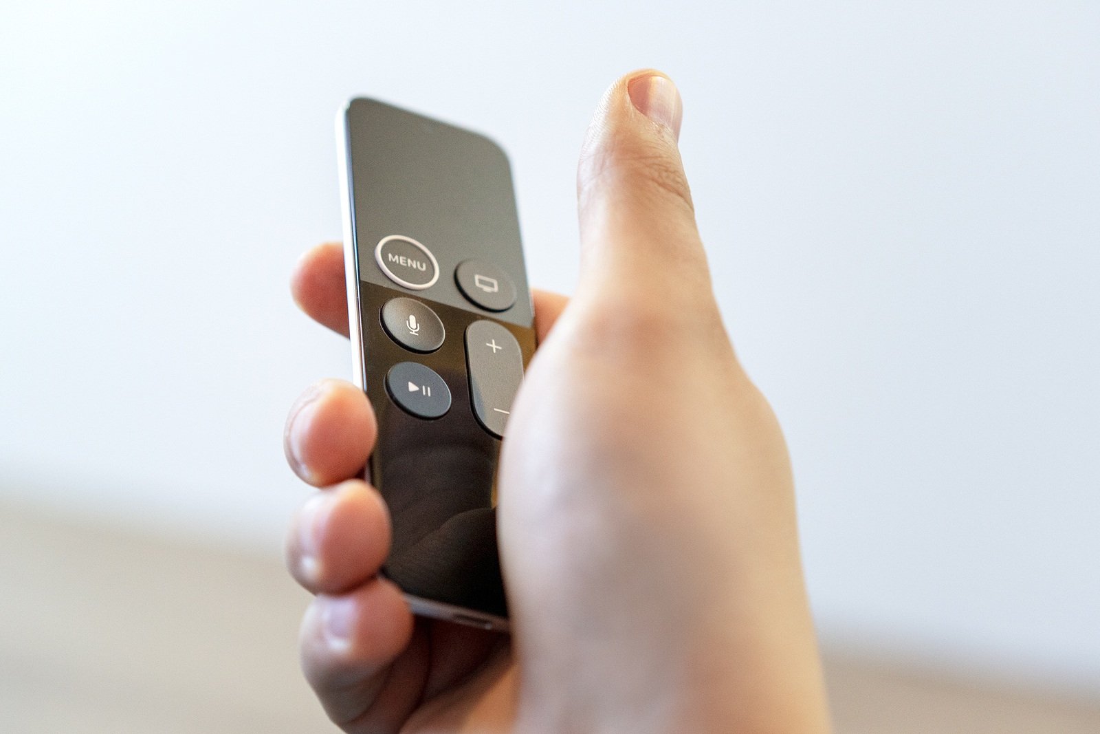 ROSTOV-ON-DON, RUSSIA - DECEMBER 20, 2018: A man remotely controlling his Apple TV device console Siri remote