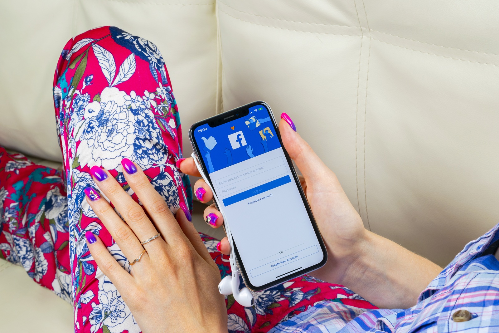Sankt-Petersburg, Russia, June 8, 2018: Facebook application icon on Apple iPhone X smartphone screen close-up in woman hands. Facebook app icon. Social media icon. Social networks