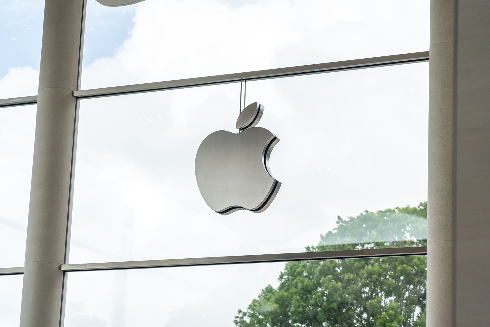 Aventura, Florida, USA - September 20, 2019: Apple store logo in Aventura Mall. It is the world's largest publicly traded company designs and sells consumer electronics and computer products.