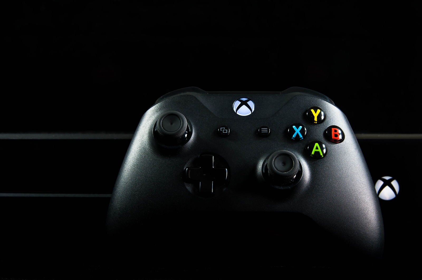 Miercurea Ciuc, Romania-23 June 2018: Xbox one video game and controller isolated on black background.