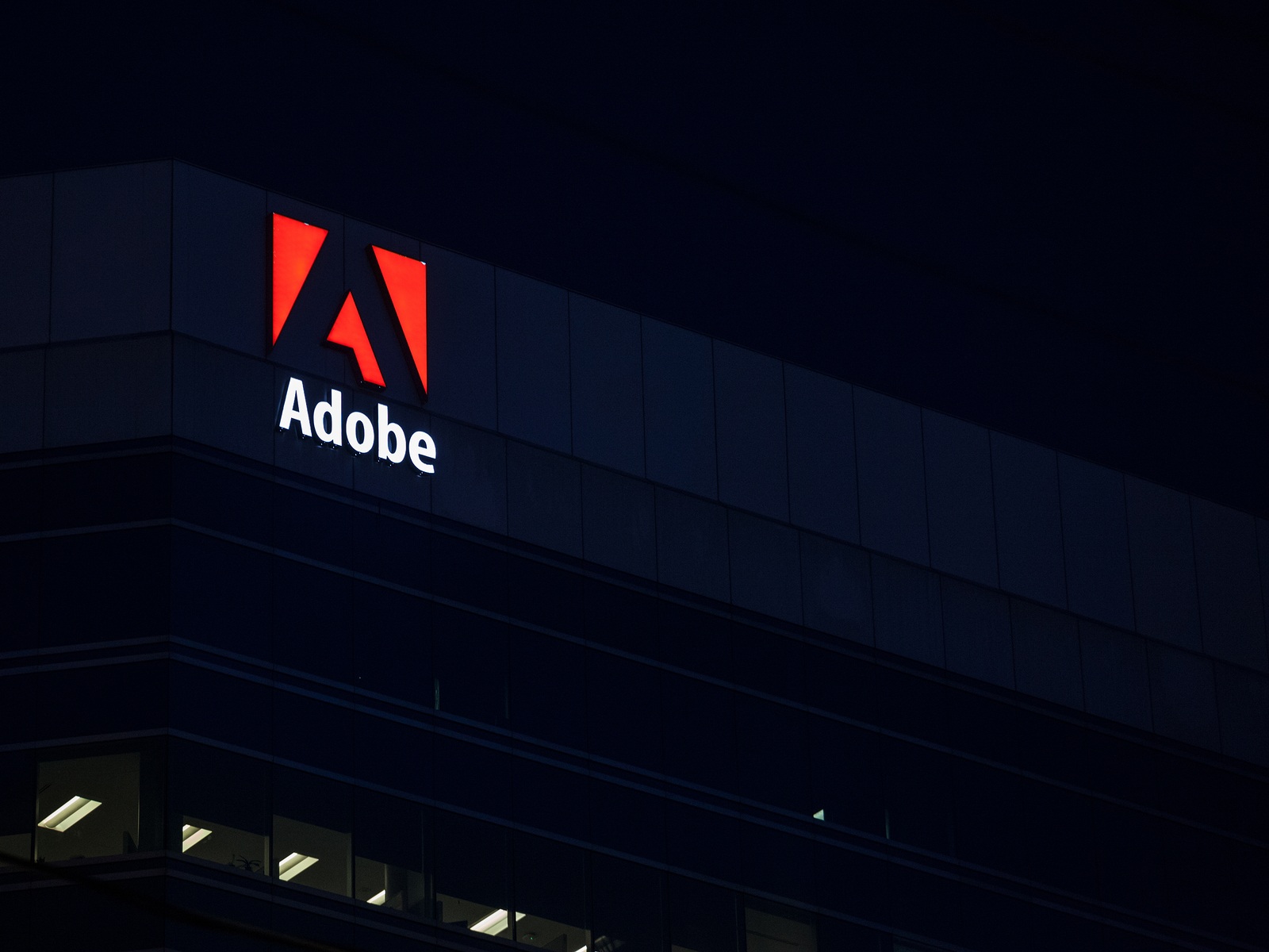 OTTAWA, CANADA - NOVEMBER 12, 2018: Adobe logo, in front of one of their main office for Ottawa, Ontario. Adobe is a computer software editor famous for its multimedia editing suites