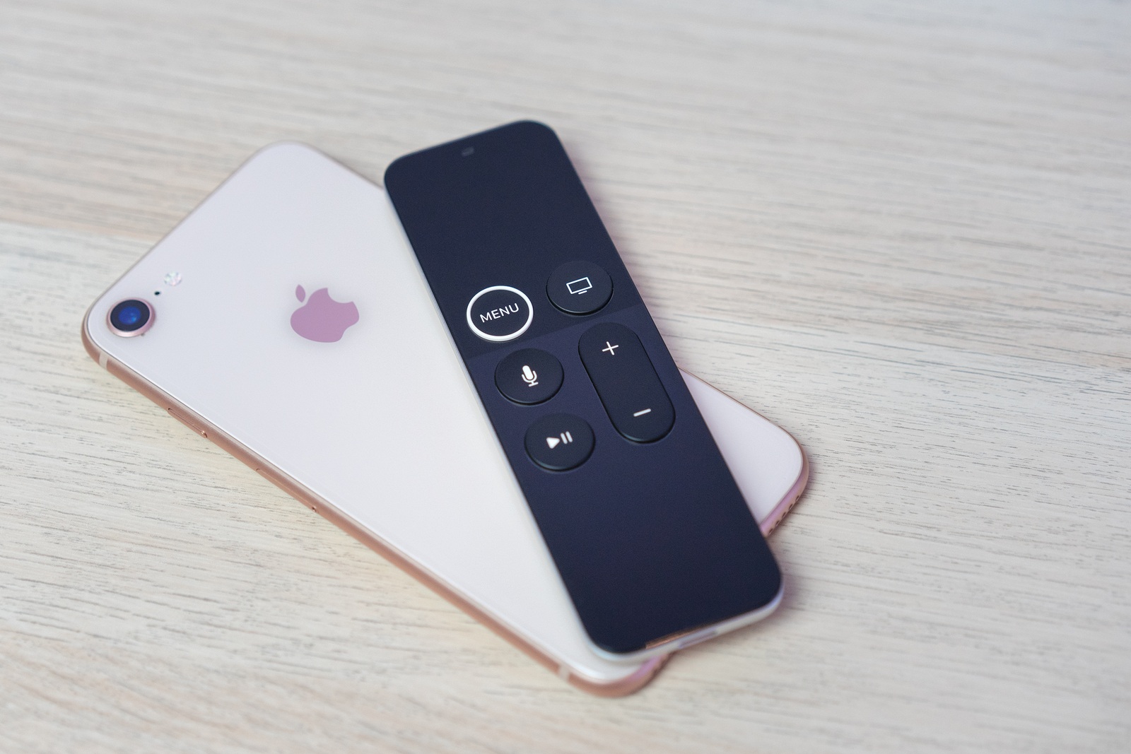 ROSTOV-ON-DON, RUSSIA - DECEMBER 20, 2018: New Apple TV media streaming player microconsole by Apple Computers futuristic touch remote swipe-to-select with integrated Siri remote and iPhone 8