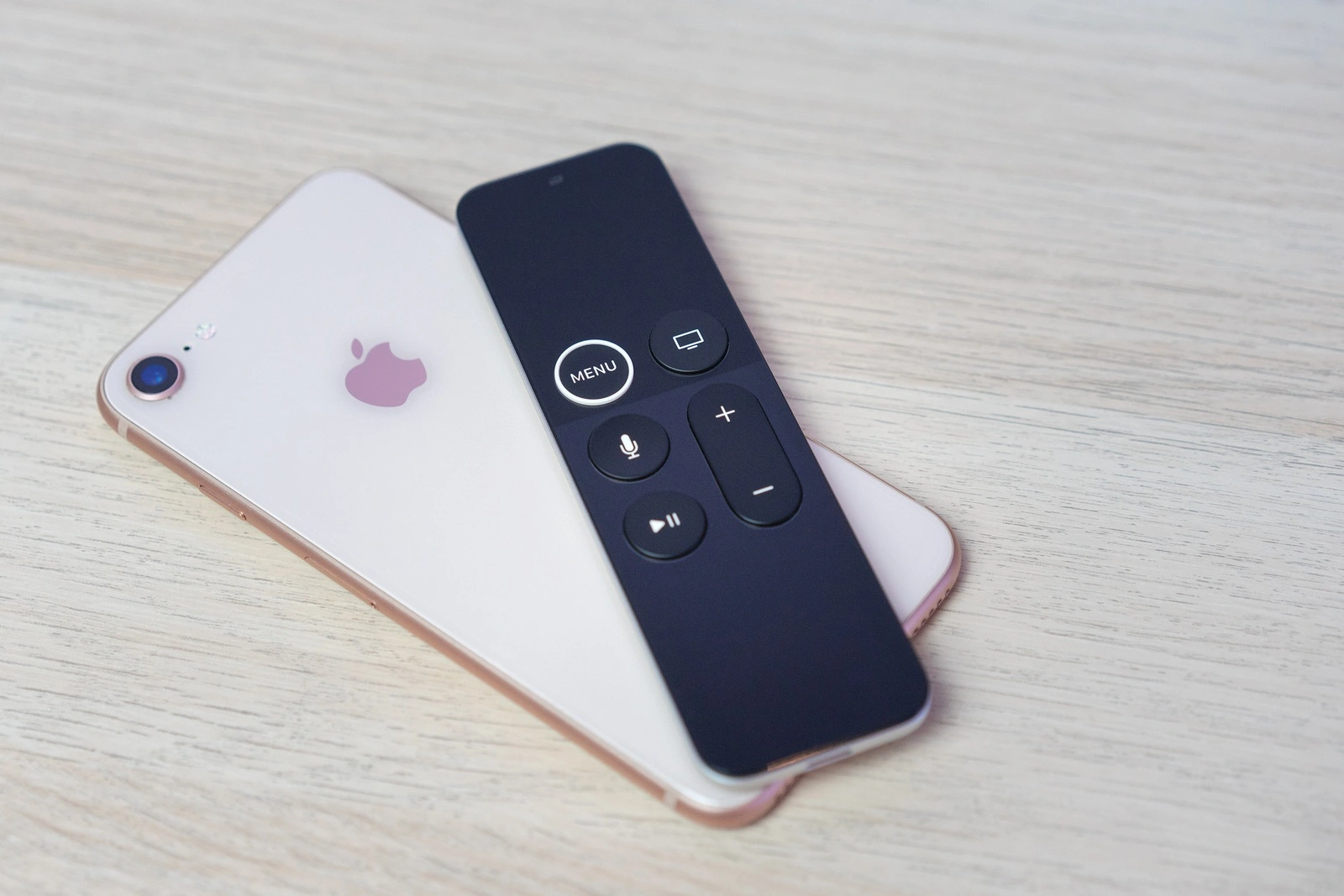 ROSTOV-ON-DON, RUSSIA - DECEMBER 20, 2018: New Apple TV media streaming player microconsole by Apple Computers futuristic touch remote swipe-to-select with integrated Siri remote and iPhone 8