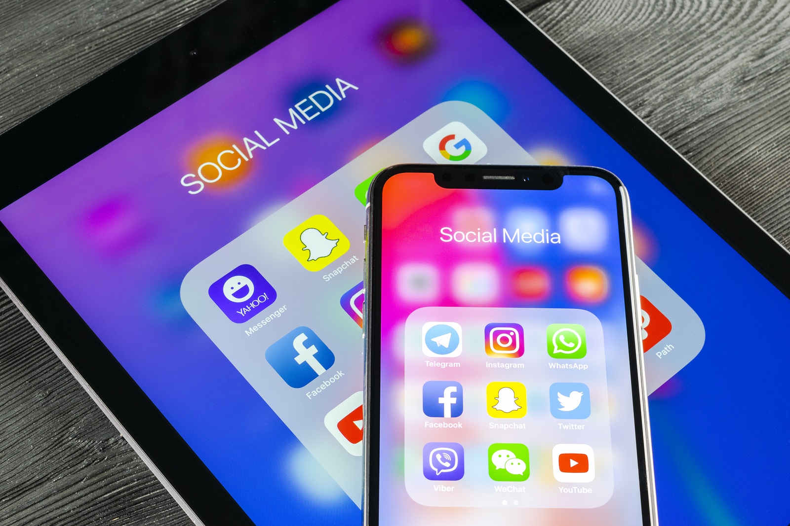 Saint-Petersburg, Russia June 8, 2018: Apple iPhone X and iPad with icons of social media facebook, instagram, twitter, snapchat application on screen. Social media icons. Social networks. Social media
