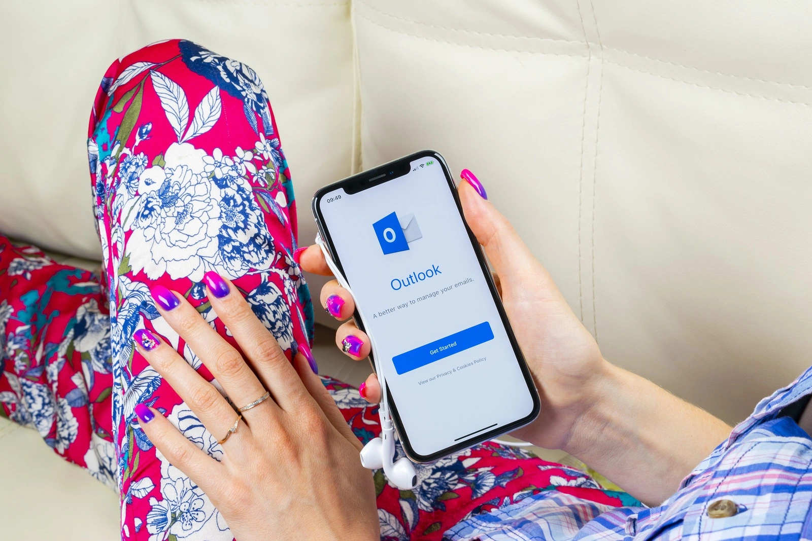 Sankt-Petersburg, Russia, June 8 2018: Microsoft Outlook office application icon on Apple iPhone X screen in woman hand. Microsoft outlook app icon. Microsoft OutLook application. Social media network