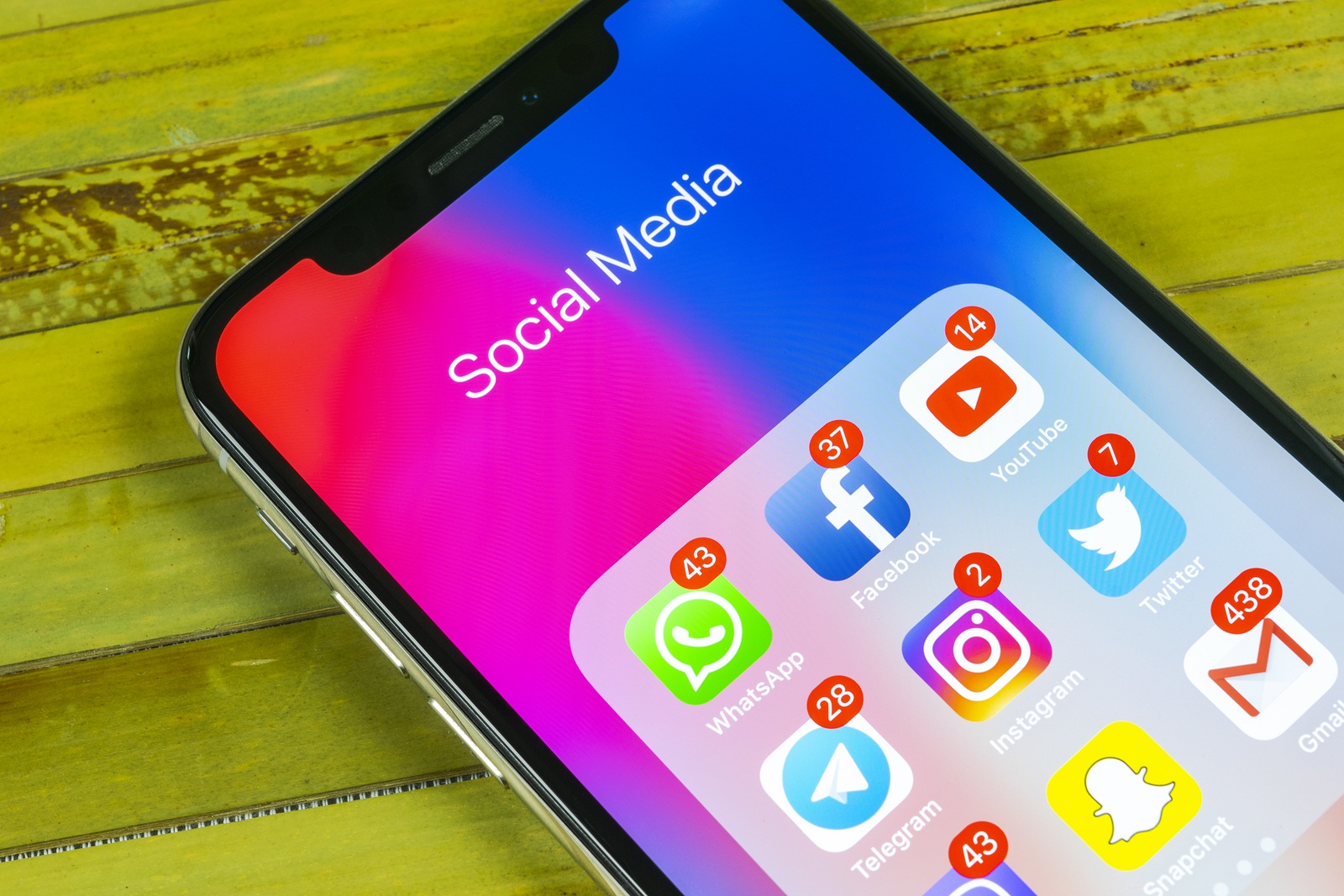 Saint-Petersburg, Russia, September 2, 2018: Apple iPhone X with icons of social media Facebook, Instagram, Twitter, Snapchat, Google application on screen. Social media icons. Social networks