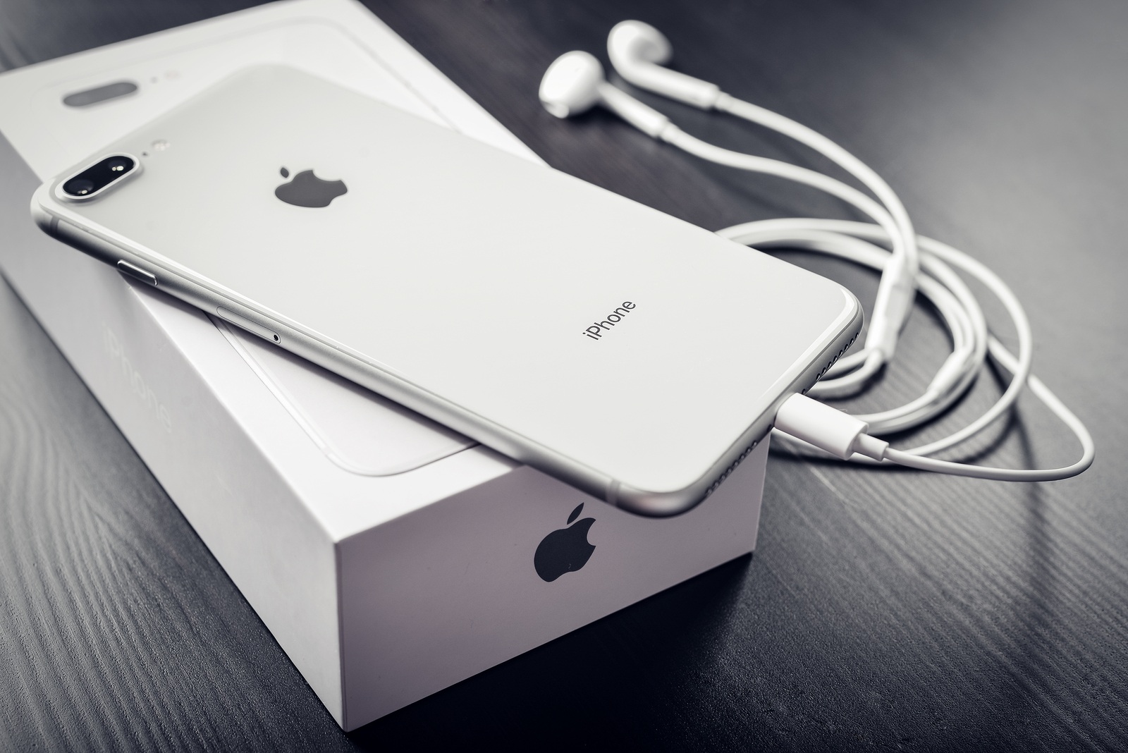 Kyiv, Ukraine - January 24, 2018: Front and back view of Apple iPhone 8 Plus Silver isolated on white background with clipping path