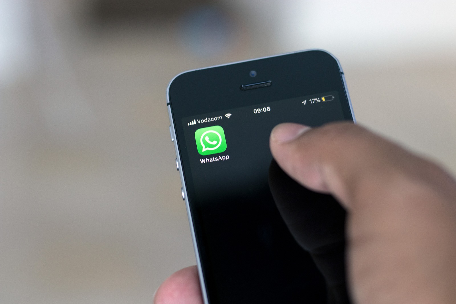 Cape Town, South Africa. March 15, 2019. Hand holding a mobile phone with the WhatsApp icon on screen.