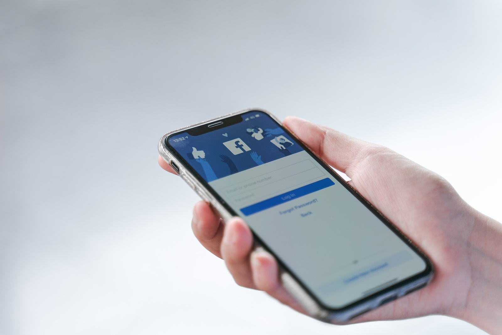 CHIANG MAI, THAILAND - Jul.27,2019: Woman holding Apple iPhone X with facebook app on the screen. Facebook is one of the most popular social media service apps in the world.