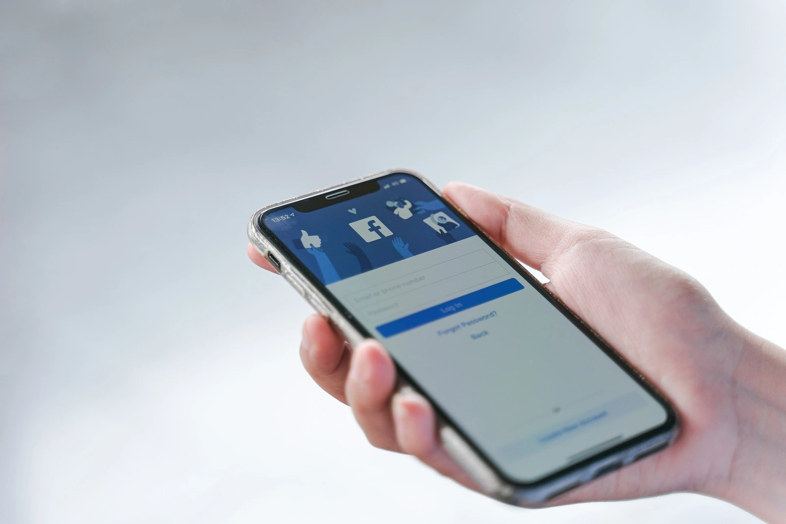 CHIANG MAI, THAILAND - Jul.27,2019: Woman holding Apple iPhone X with facebook app on the screen. Facebook is one of the most popular social media service apps in the world.