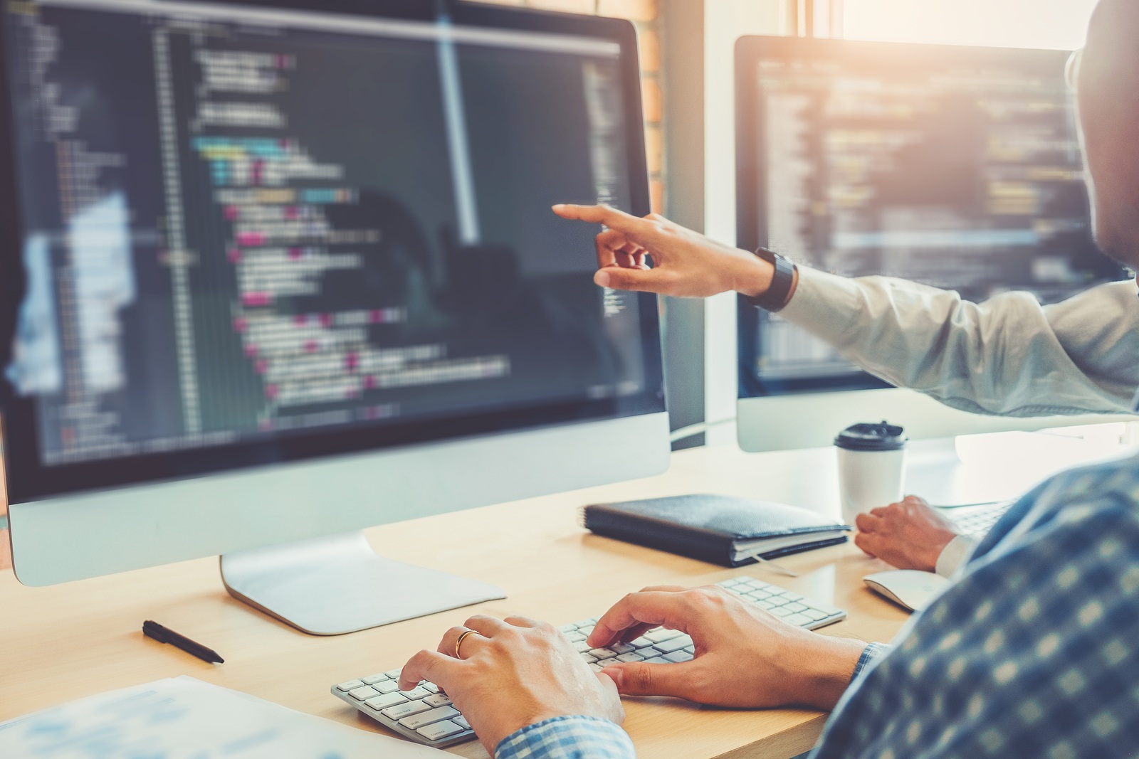 Developing programmer team development website design and coding technologies working in software company office