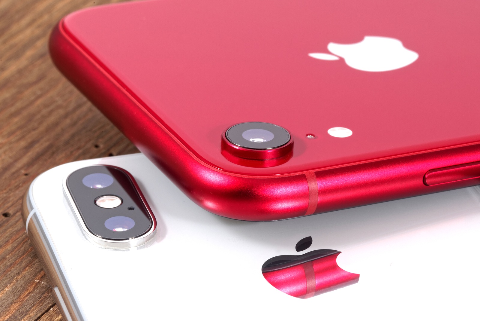 Koszalin, Poland - November 29, 2018: Silver iPhone Xs and red iPhone XR. The iPhone Xs and iPhone XR is smart phones with multi touch screen produced by Apple Computer, Inc.
