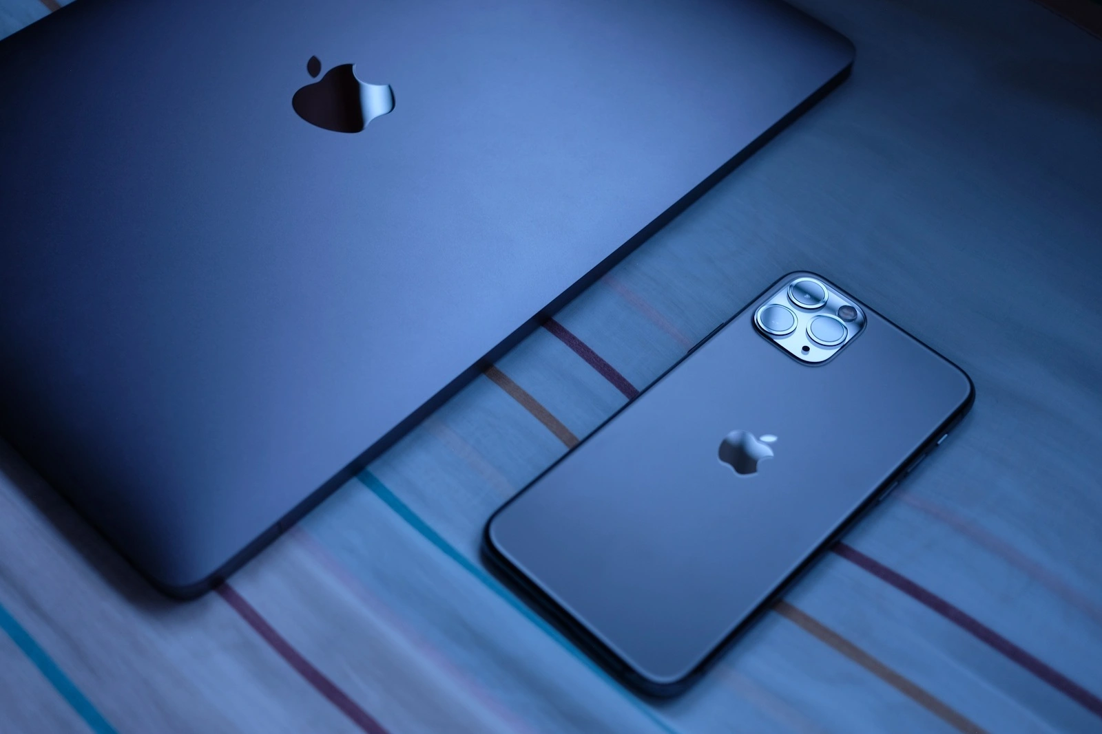Trang, Thailand. October 24, 2019 : Customer lay down new macbook pro 2019 and iphone 11 pro are space gray colors on bed after receive from the apple store