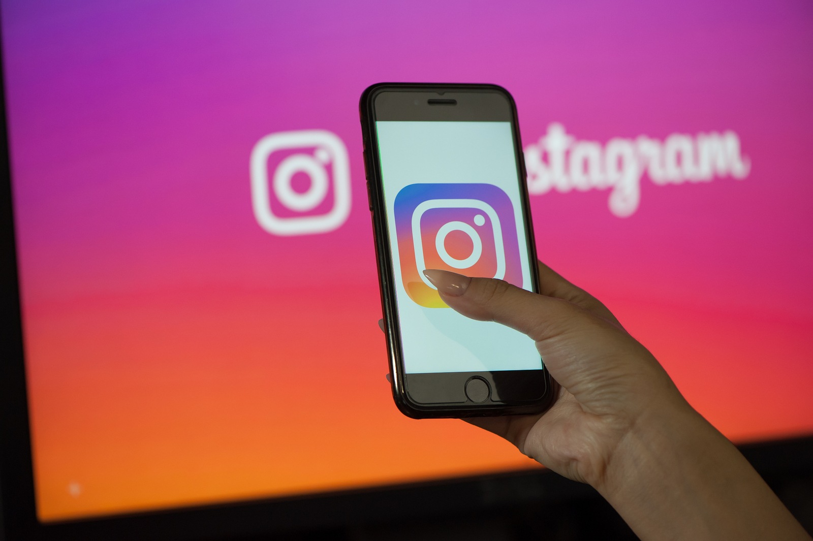 Saint-Petersburg / Russian Federation - March 11, 2019: Female hand holding cellphone with starting page of Instagram