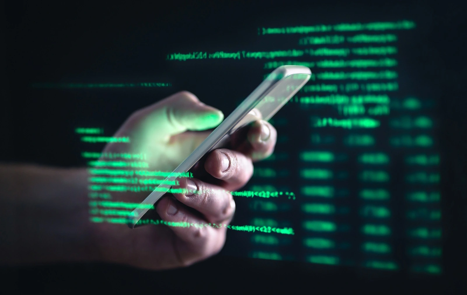 Darkweb, darknet and hacking concept. Hacker with cellphone. Man using dark web with smartphone. Mobile phone fraud, online scam and cyber security threat. Scammers using stolen cells. AR data code.