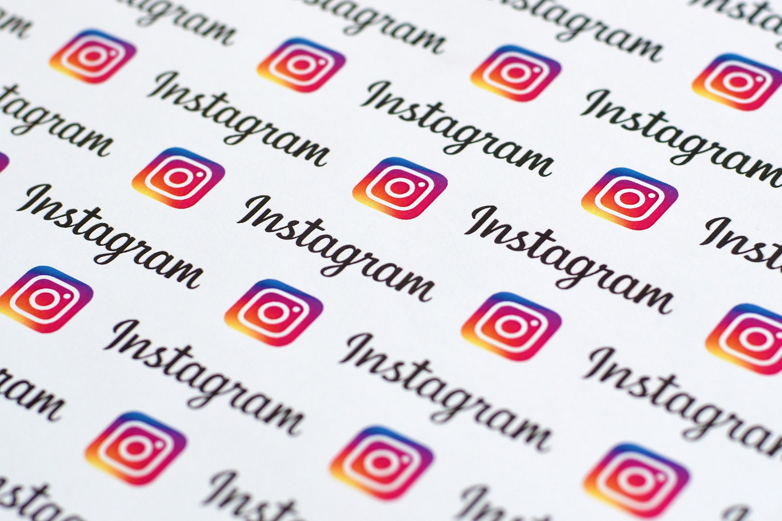 Instagram pattern printed on paper with small instagram logos and inscriptions. Instagram is an American photo and video sharing social networking service owned by Facebook