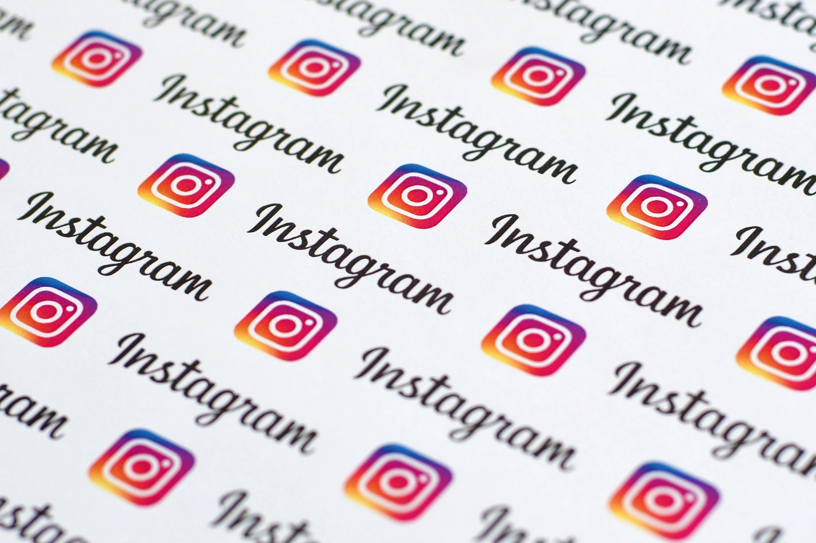 Instagram pattern printed on paper with small instagram logos and inscriptions. Instagram is an American photo and video sharing social networking service owned by Facebook