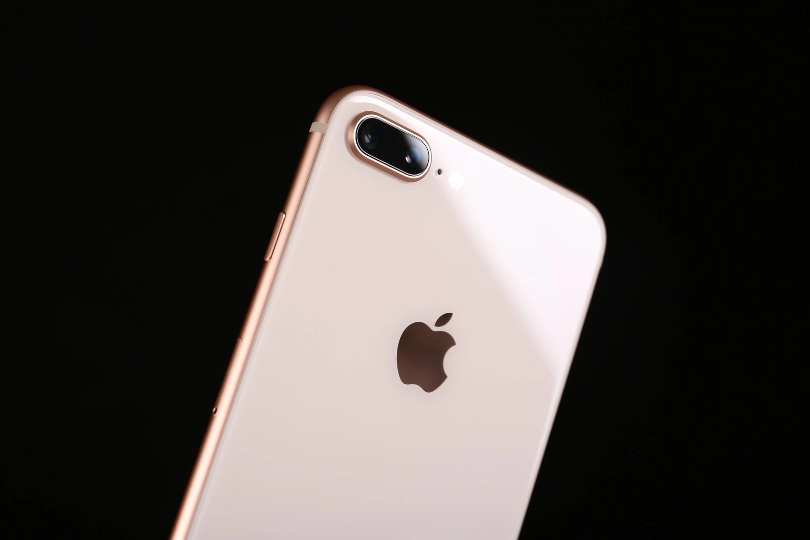 KIEV, UKRAINE - OCTOBER 23, 2017: Back panel of iPhone 8 Plus Gold on black background