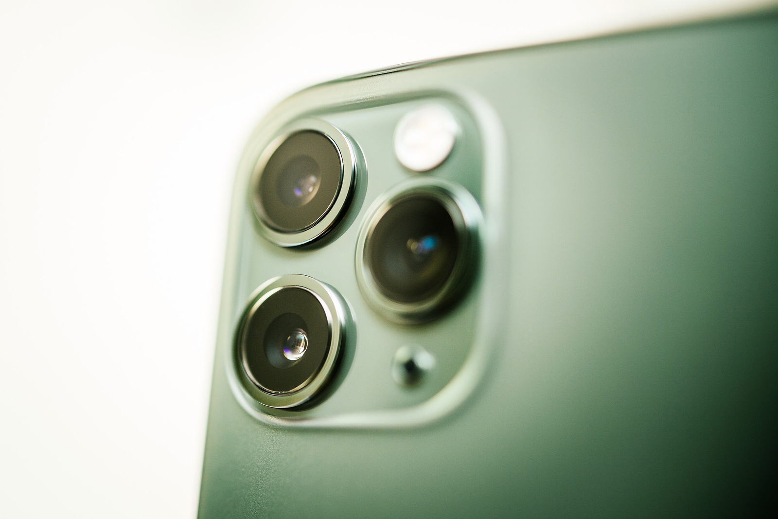 Paris, France - Sep 20, 2019: Close-up macro details of new latest Apple Computers iPhone 11 Pro and 11 Pro Max smartphone triple-lens camera and new technology - focus on telephoto lens