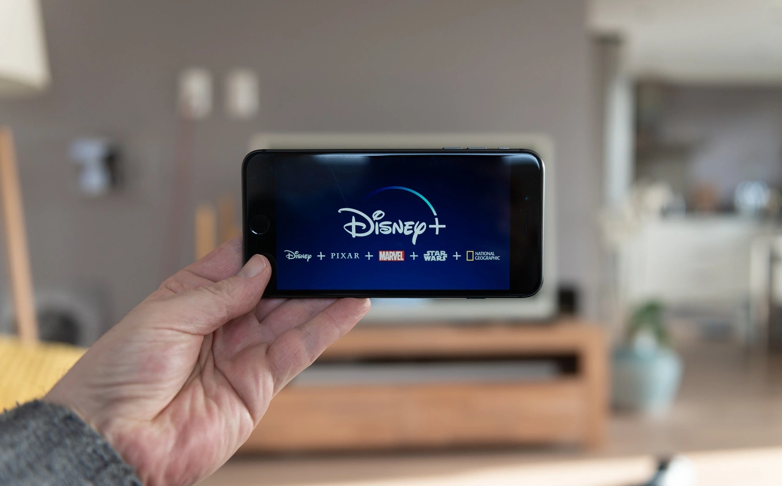 Amsterdam, The Netherlands, 02/03/2020, Disney+ start screen on mobile phone. Disney+ online video, content streaming subscription service. Disney plus, Star Wars, Marvel, Pixar, National Geographic.