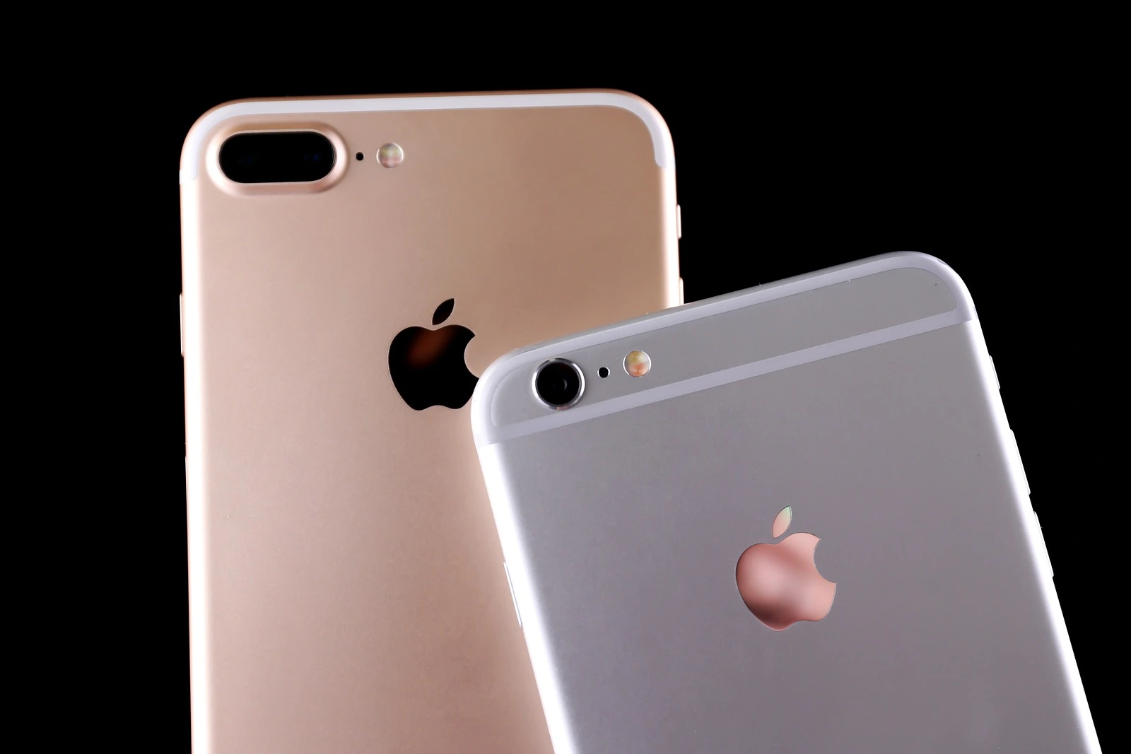KIEV, UKRAINE - OCTOBER 19, 2017: Back panels of iPhone 7 Plus Gold and iPhone 6s Plus Silver on black background