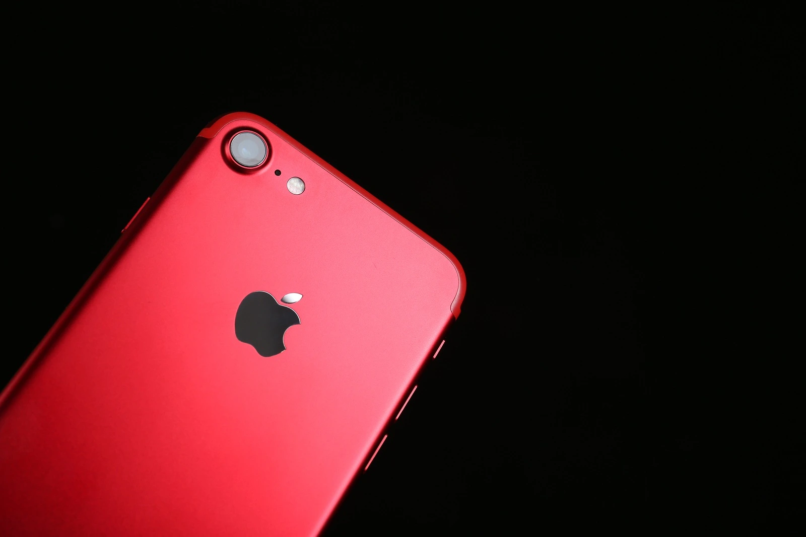 KIEV, UKRAINE - OCTOBER 23, 2017: Back panel of iPhone 7 Red on black background