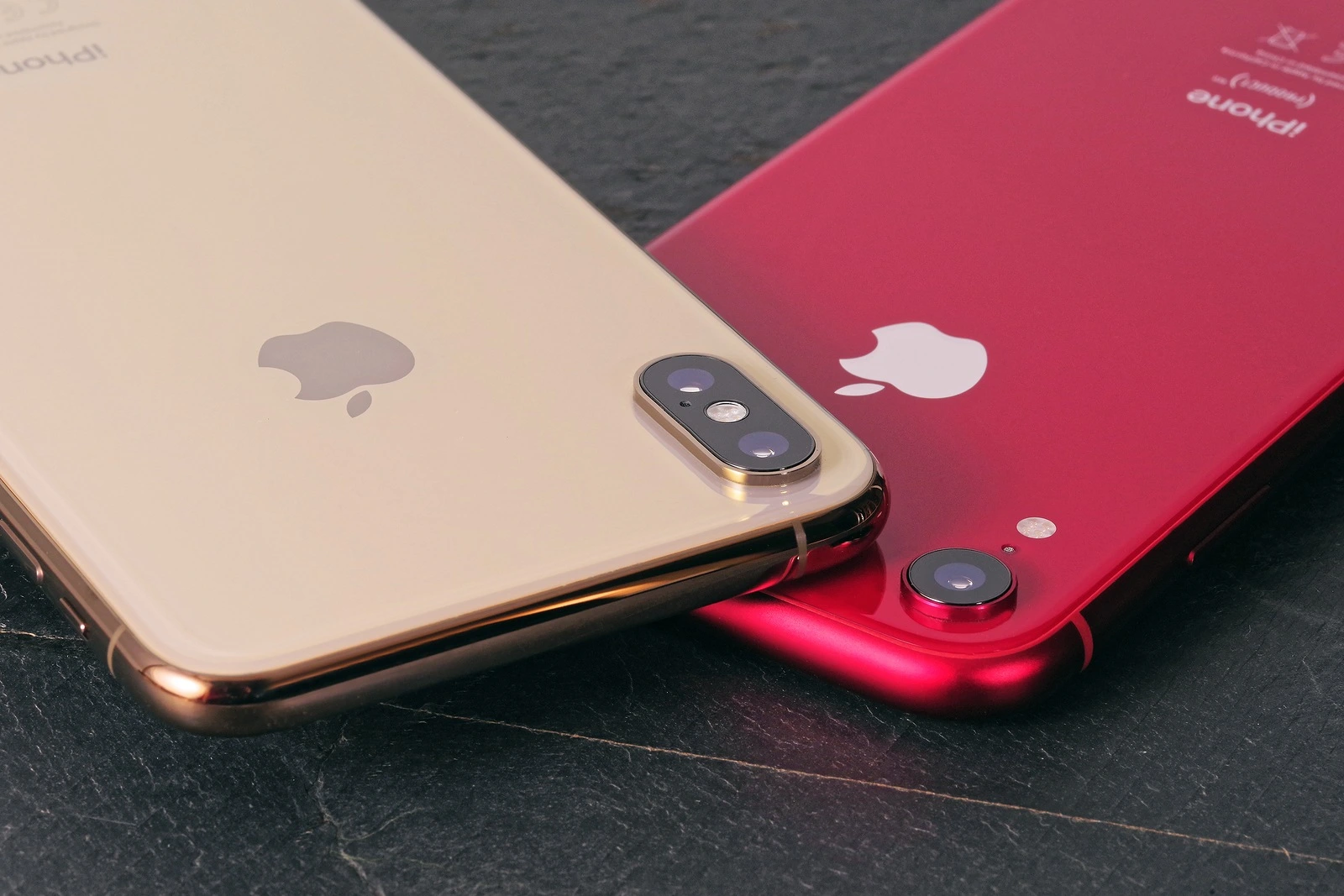 Koszalin, Poland - November 12, 2018: Golden iPhone XS Max and red iPhone XR. The iPhone XS Max and iPhone XR are smart phones with multi touch screen produced by Apple Computer, Inc.