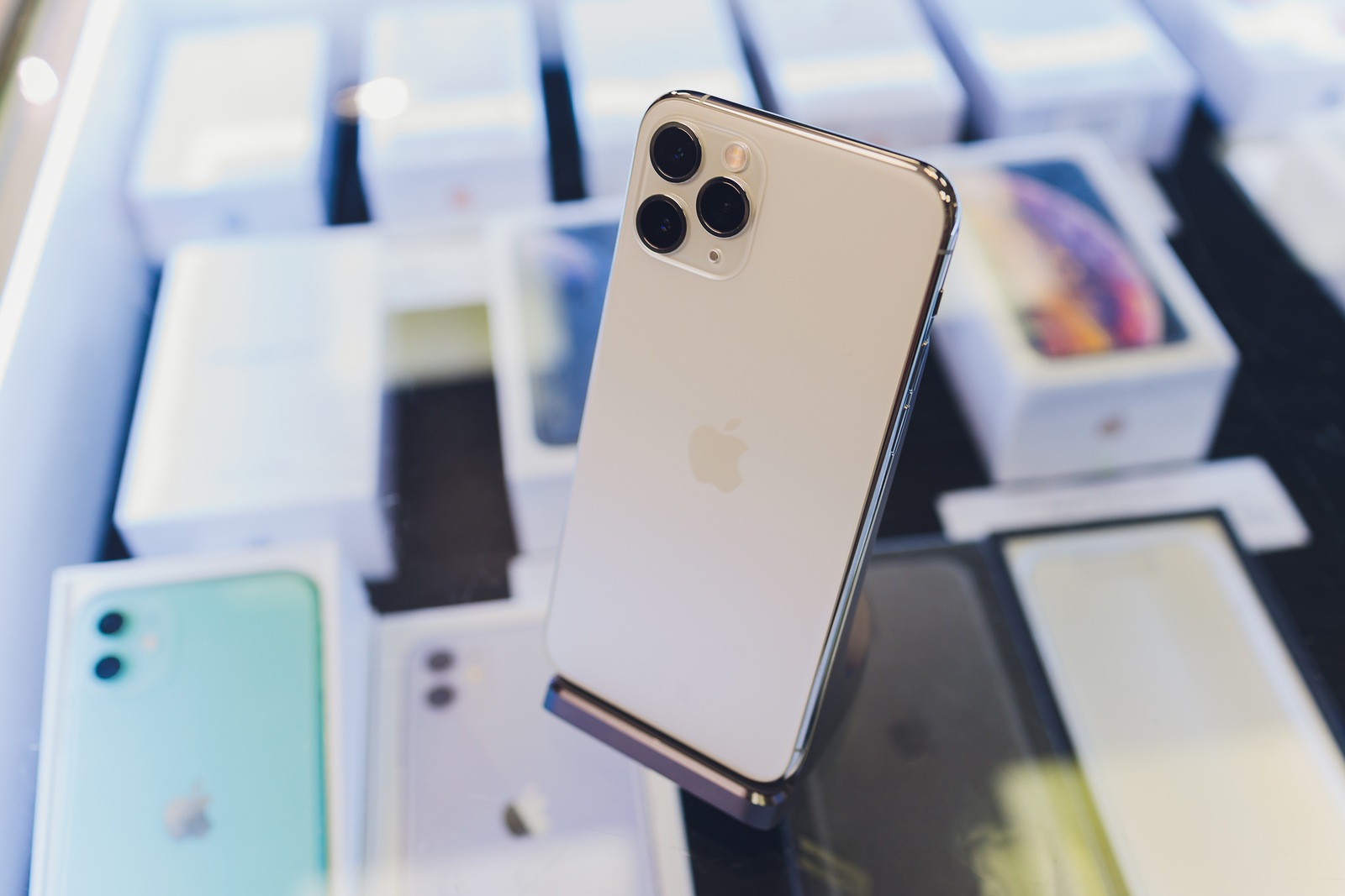 Ufa, Russia, September 24, 2019: The iPhone 11, 11 Pro and Pro Max are displayed as the smartphone by Apple Computers goes on sale rear view of triple-camera.