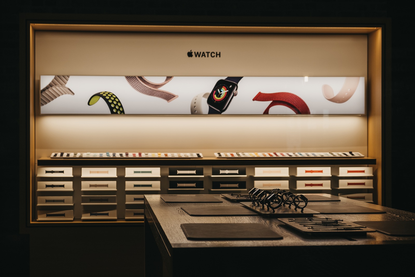 London, UK - August 31,2019:Through the window view of the Apple watches on a table at Apple Store in Covent Garden, London, UK. Apple Covent Garden is Apple's flagship store in the UK refurbished in 2018