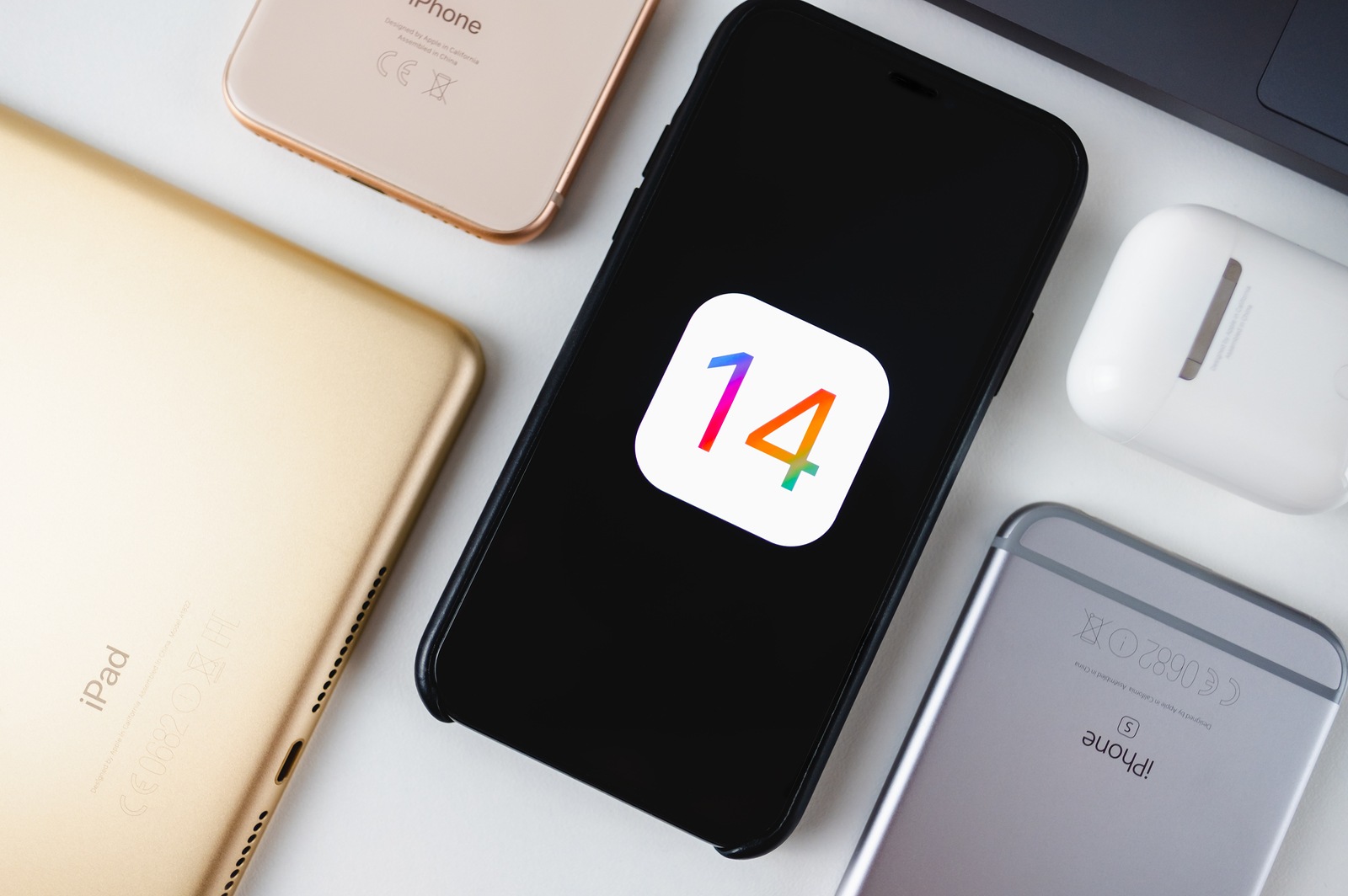 iPhone with iOS 14 logo on the screen close up, new operating system 2020 on apple devices.
