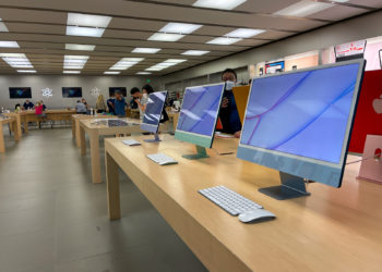 Orlando, FL USA - September 20, 2021: A row of iMac computers at an Apple store.