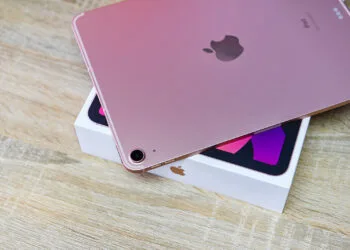 Bangkok, Thailand - August 21, 2021: New Apple iPad rose gold color, camera and rear view logo Apple launch Tablet iPad Air 2020-2021 (4th Gen.) with box on white background