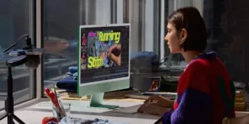 Video editing on a green iMac: a woman works on a sewing video, a typical use case for the iMac M6