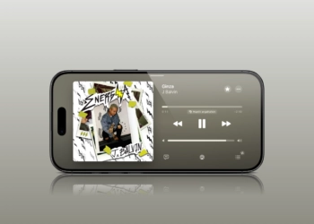 Apple Music on iOS 27 in landscape mode with playing track and left-aligned sidebar