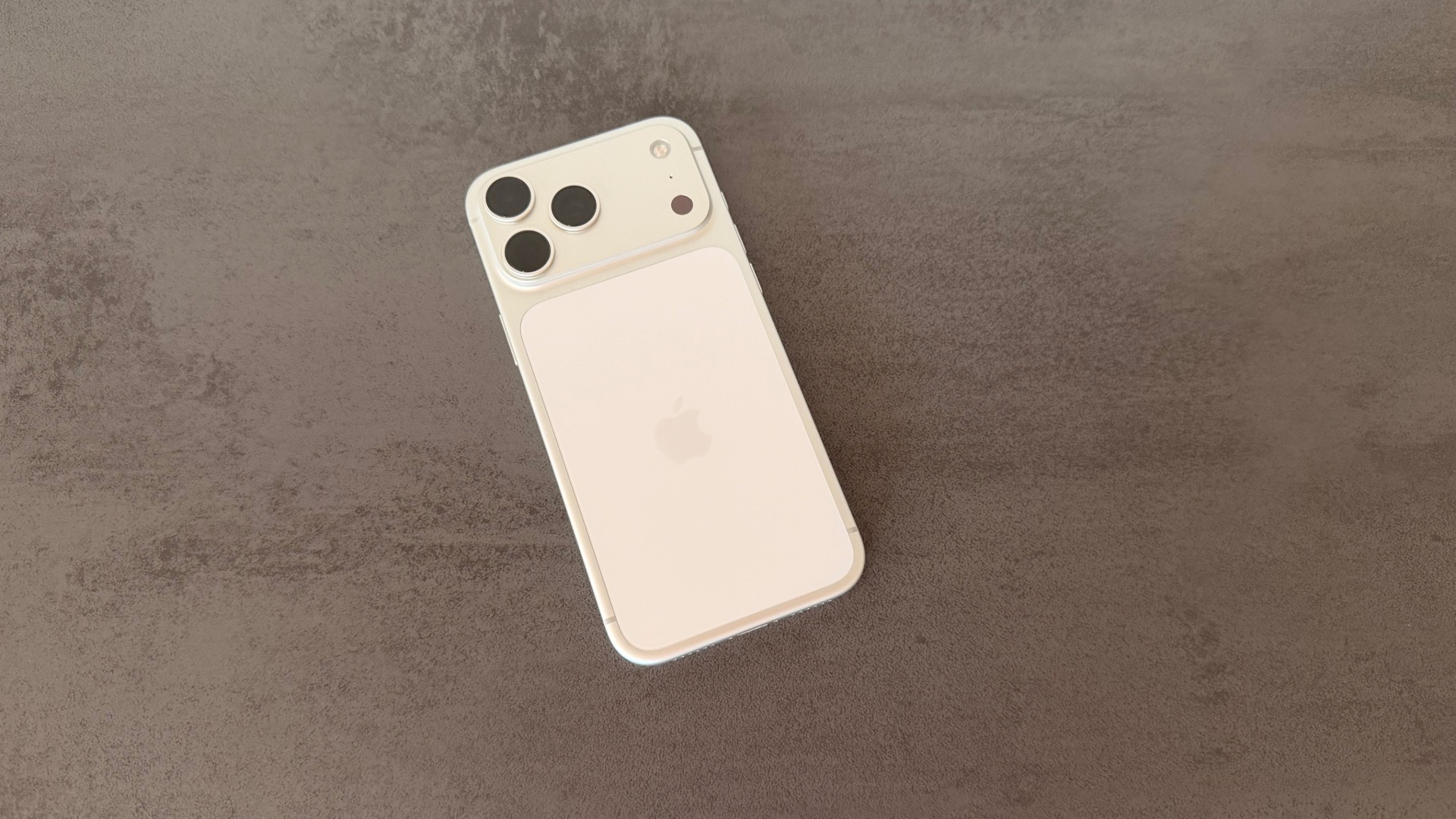 iPhone 17 Pro Max in silver with visible back on a dark background