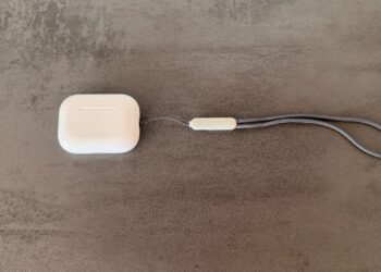 AirPods Pro 3 in white with closed charging case against a dark background