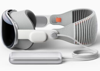 Apple Vision Pro with head band and external battery on a light background, the headset is now also being used in the operating room