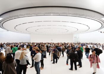 Guests in the lobby of the Steve Jobs Theater beneath the circular ceiling element, venue for the keynote at Apple's September event
