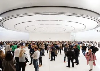 Guests in the lobby of the Steve Jobs Theater beneath the circular ceiling element, venue for the keynote at Apple's September event