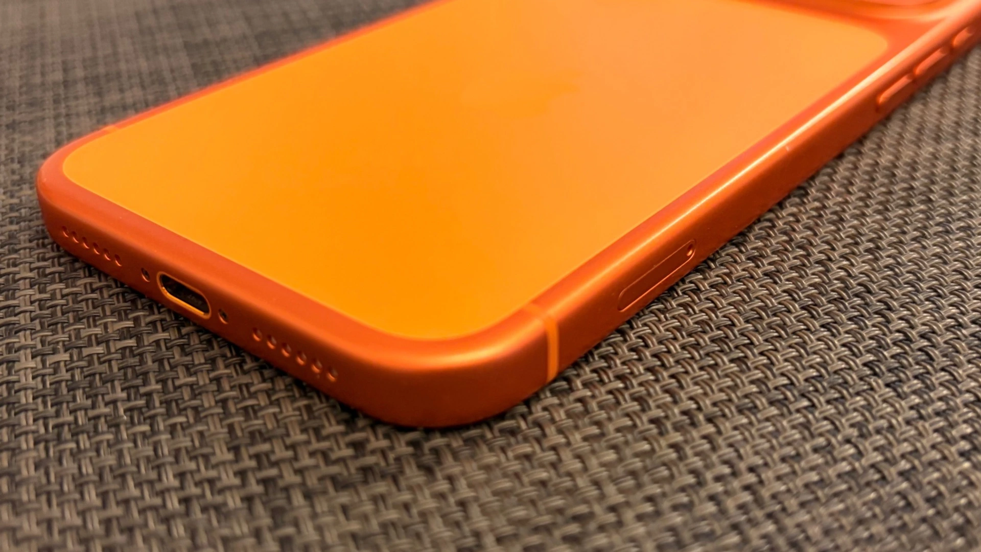iPhone 17 Pro Max in Cosmic Orange on a dark background, symbolic image of iPhone production in India