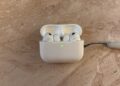 Open charging case with two earbuds whose stems are visible – this is where the AirPods with camera are said to house their sensors.