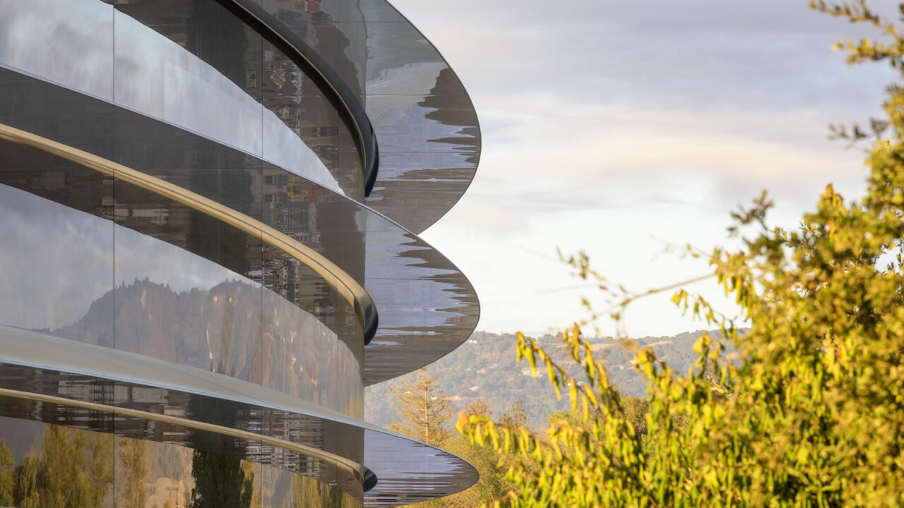 The curved glass facade of Apple Park in Cupertino, where Apple is conducting its defense in the DOJ proceedings.