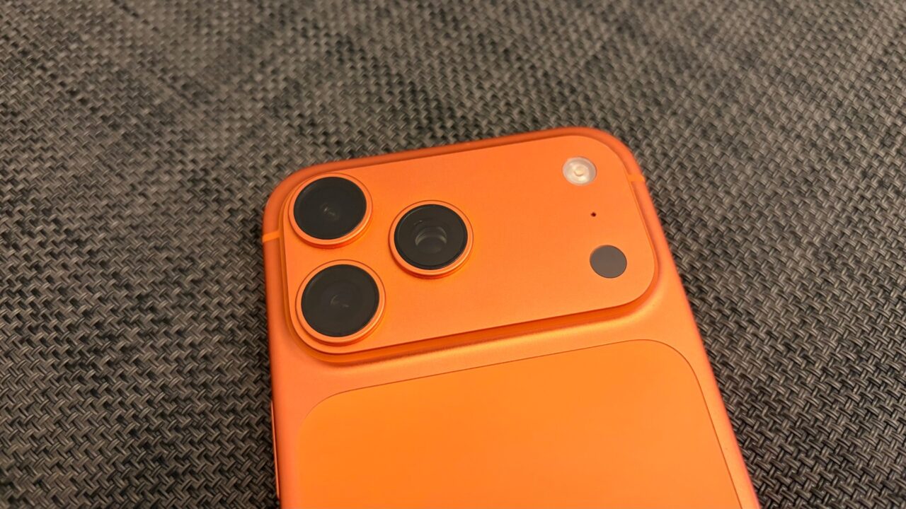 Camera plateau of an iPhone 17 Pro Max in Cosmic Orange, whose image sensor carries the provenance data for Apple Reference Image