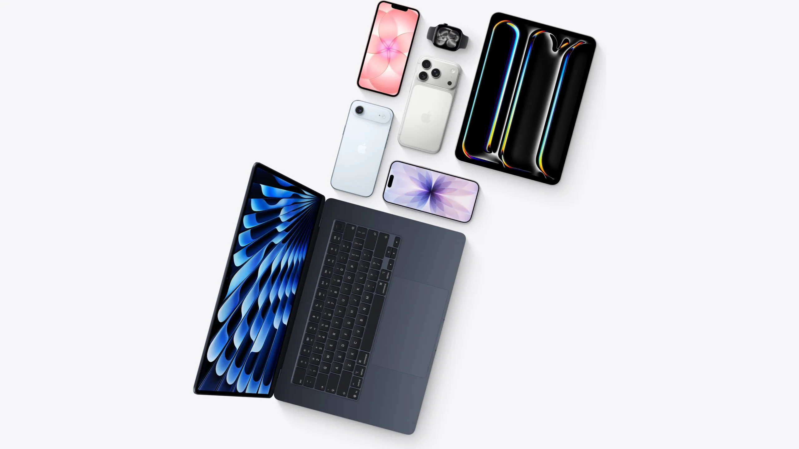 Overhead arrangement of a MacBook, iPad, several iPhones and an Apple Watch as offered through the Apple Upgrade leasing program